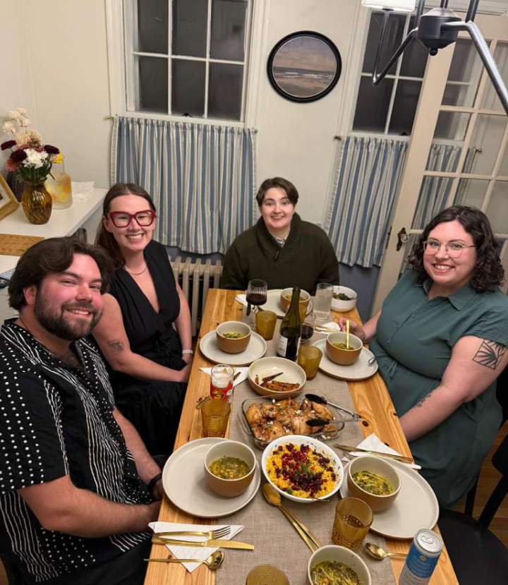 Friends gathered around a shared dinner